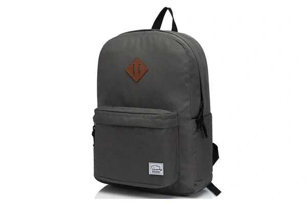 Black Vaschy UltraLight Backpack with its front zip pocket, diamond patch and woven brand label.
